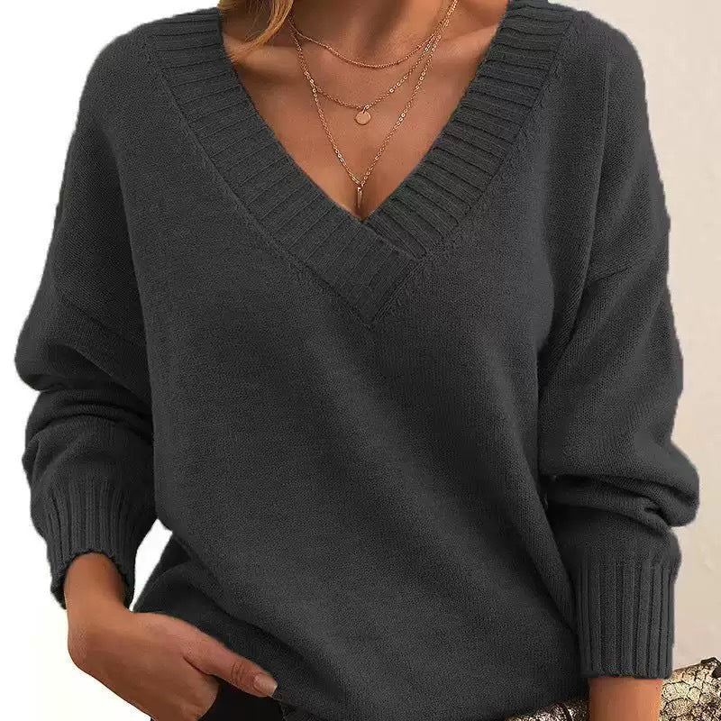 Women's relaxed V-neck knit sweater with ribbed cuffs and neckline for cozy all-day comfort