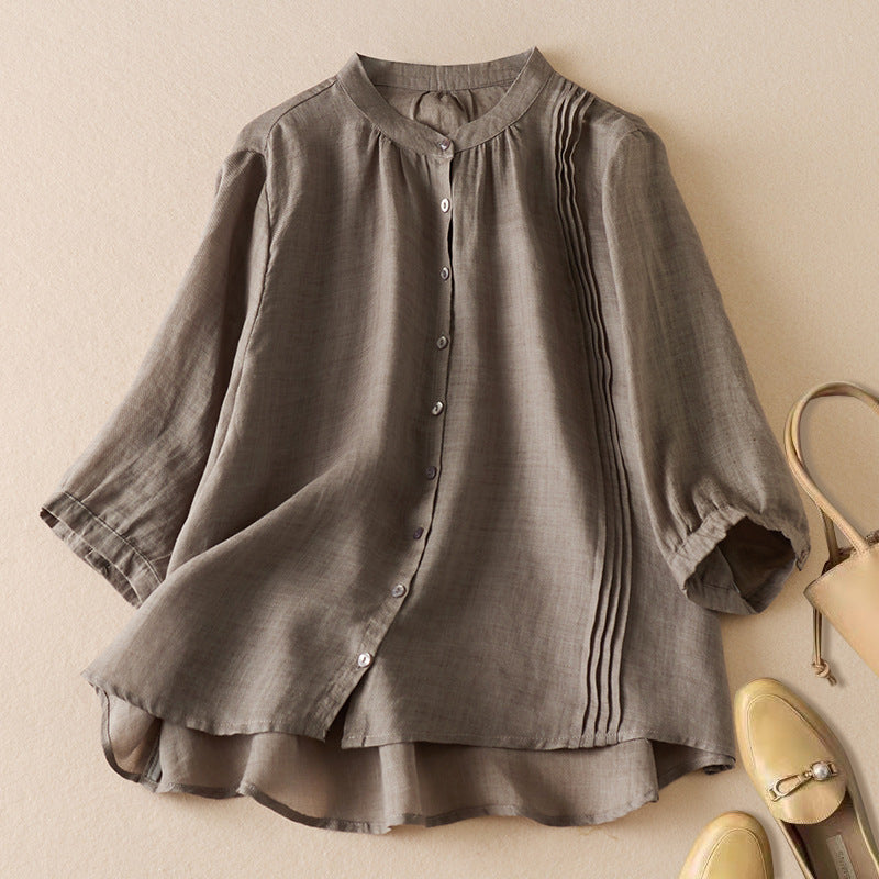 Women's relaxed fit natural fiber shirt with stand collar and timeless pleated detail