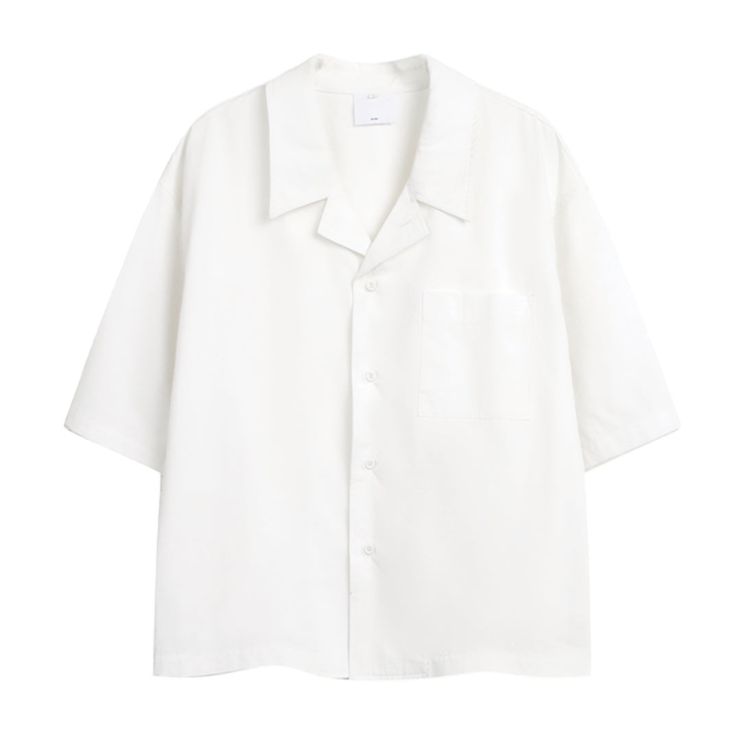 Cropped boxy organic cotton shirt with side-cut detail, lightweight unisex summer essential