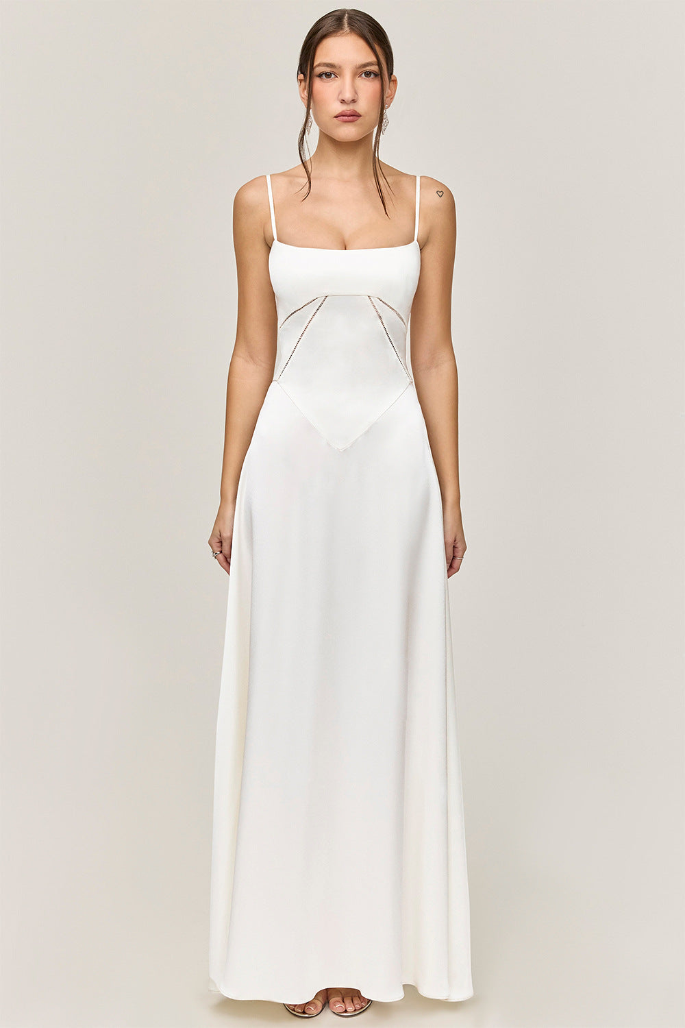 Women's satin A-line long dress with spaghetti straps and cut-out waist detail for glamorous evenings