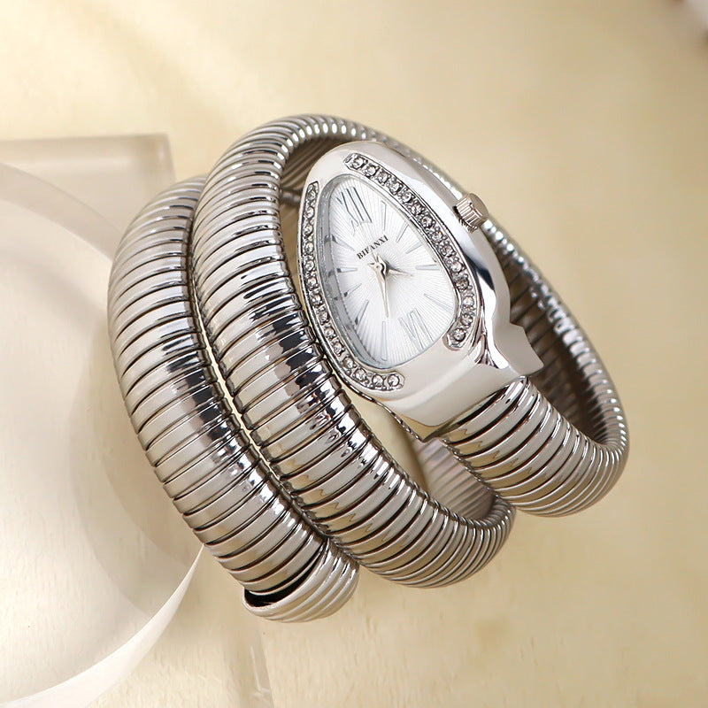 Women's snake-inspired quartz watch with custom bracelet, lightweight elegant gold-tone fashion accessory