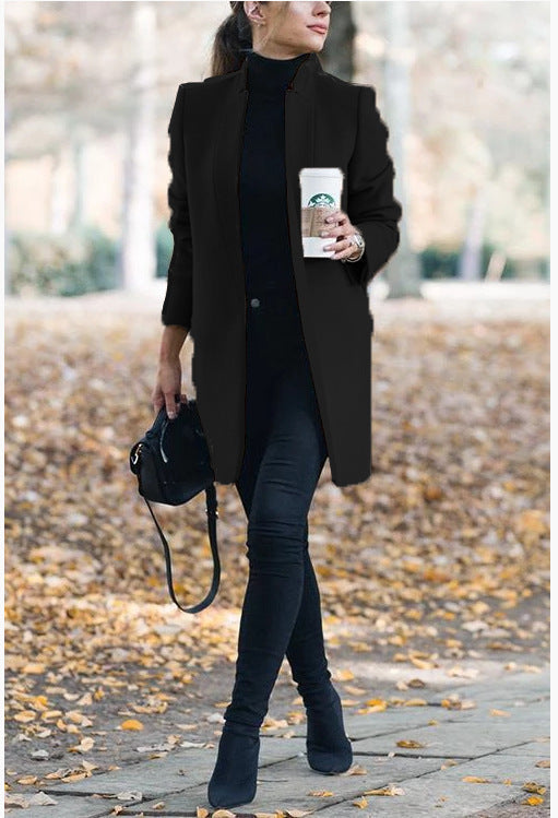 Women's tailored wool blend knee-length coat minimalist chic streamlined silhouette