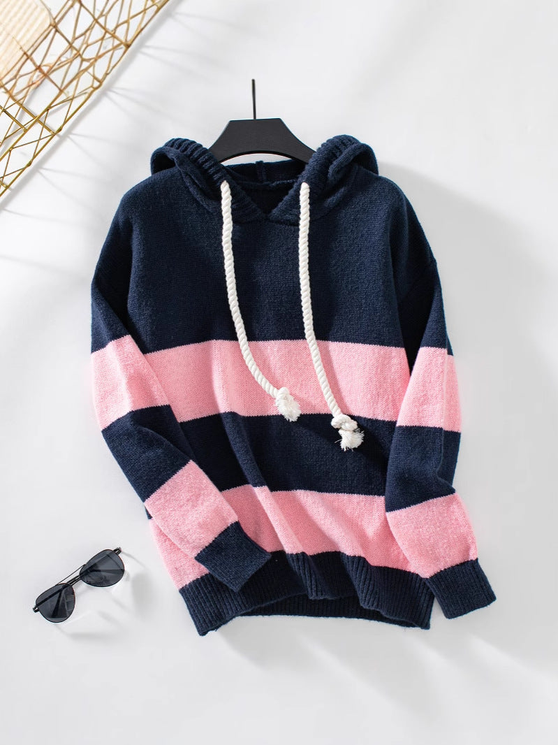 Women's color block knit hoodie in bold contrasting hues with drawstring hood, cozy fall style