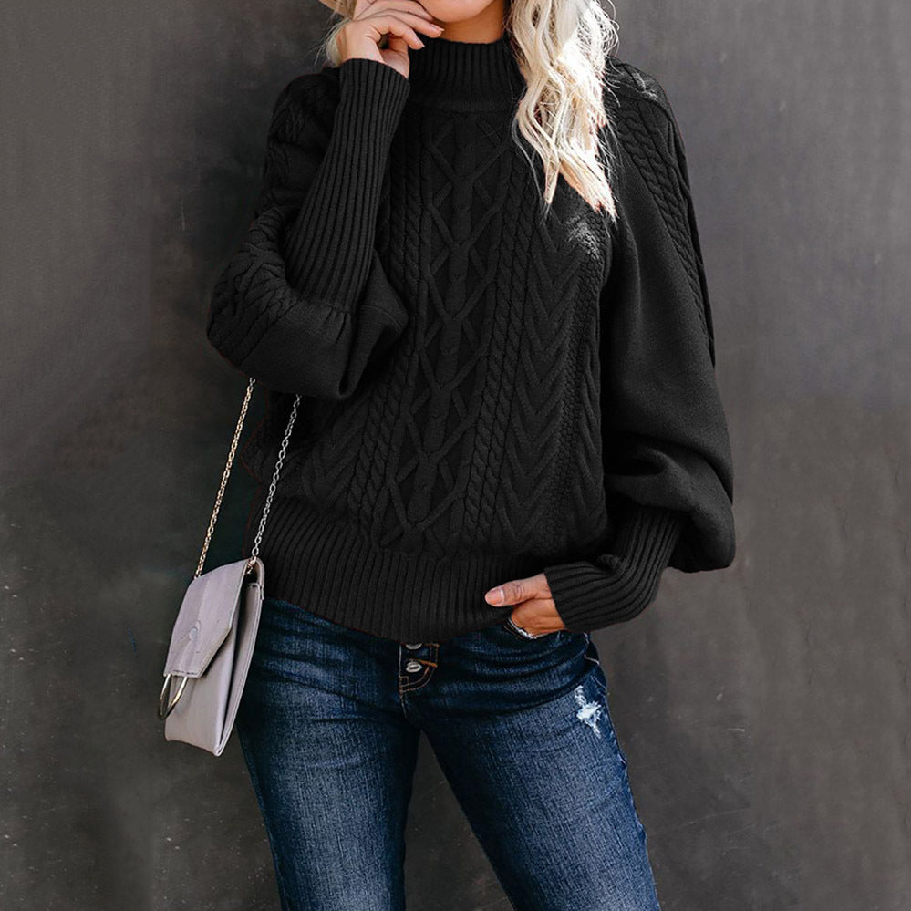 Women's chunky knit sweater in cozy neutral tone with high collar, voluminous sleeves, and hooded design