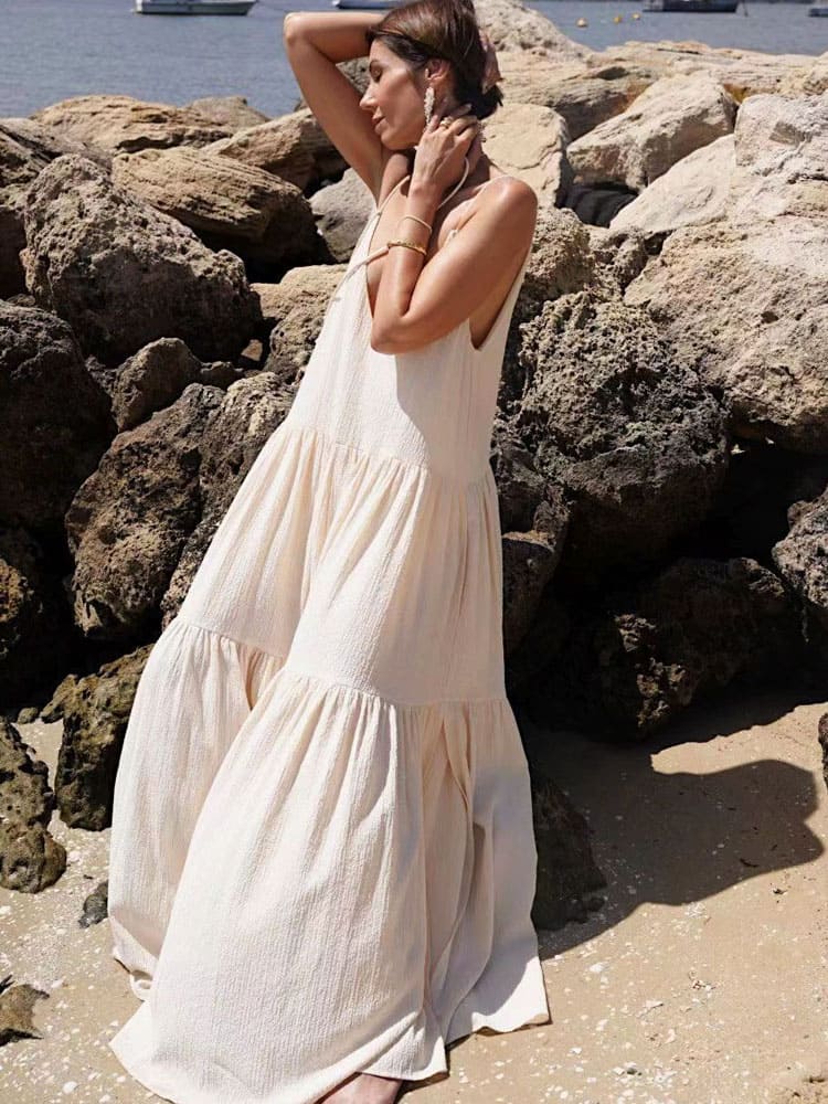 Women's light blue tiered maxi dress with delicate pleats and adjustable straps for summer