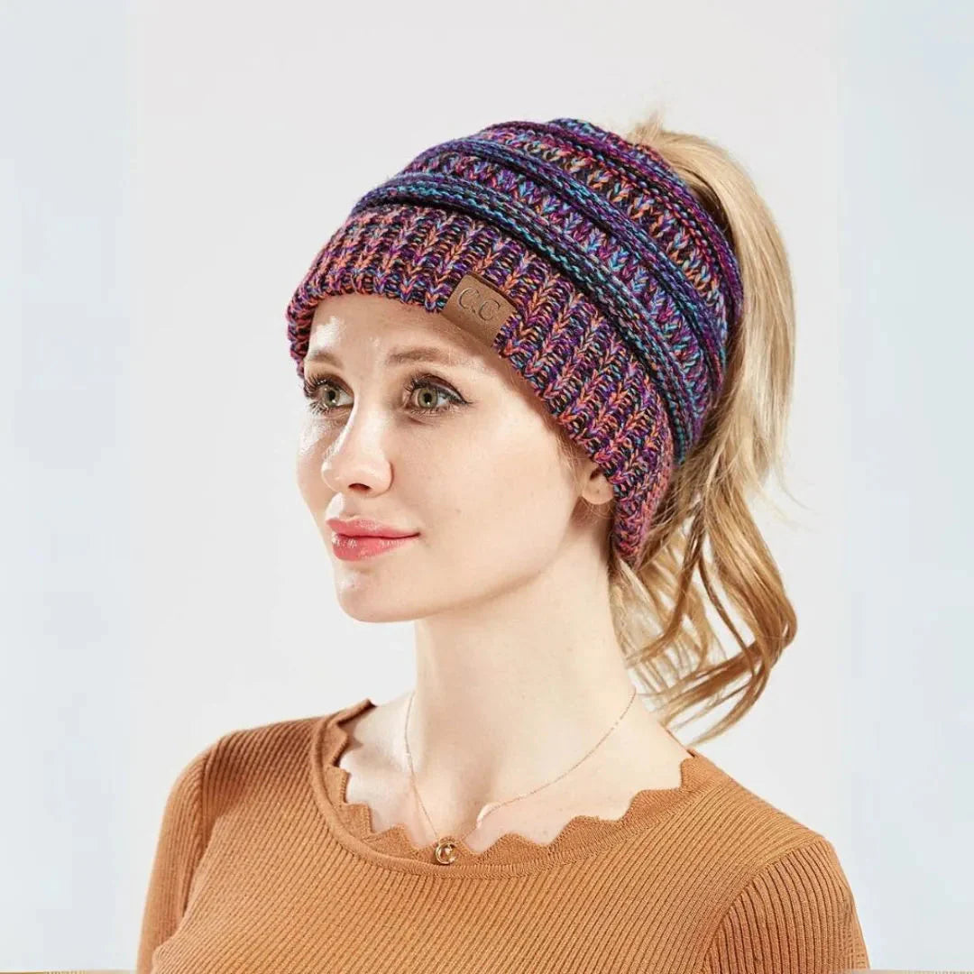Women's chunky knit ponytail beanie in neutral tones with convenient hair opening slot