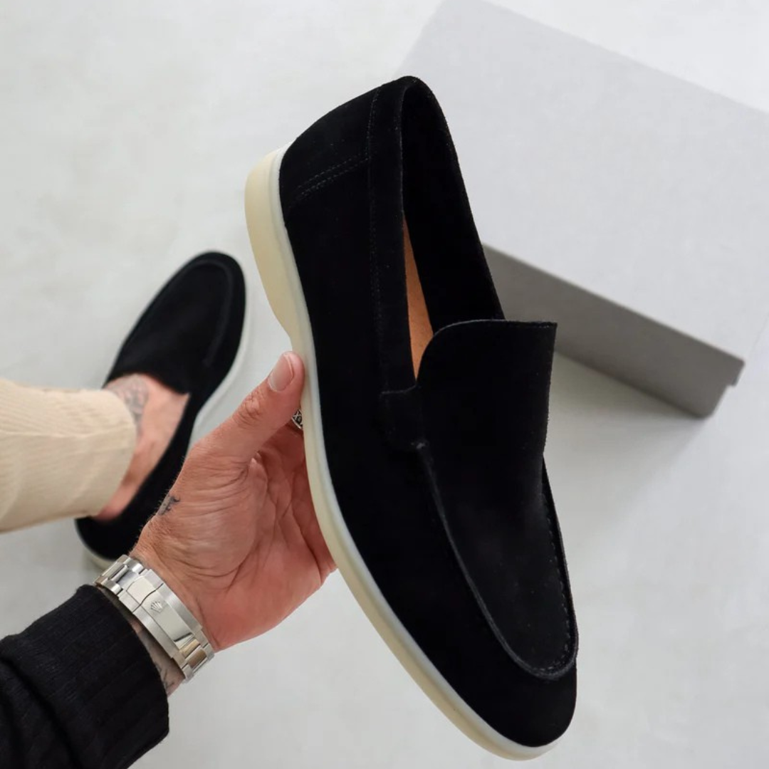 Classic leather-look slip-on loafers with moccasin silhouette and stitched detailing, unisex elegant style
