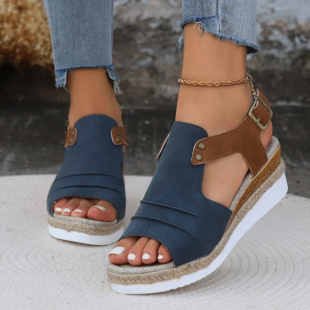 Women's open toe wedge sandals in neutral tone with adjustable buckle strap and cushioned sole