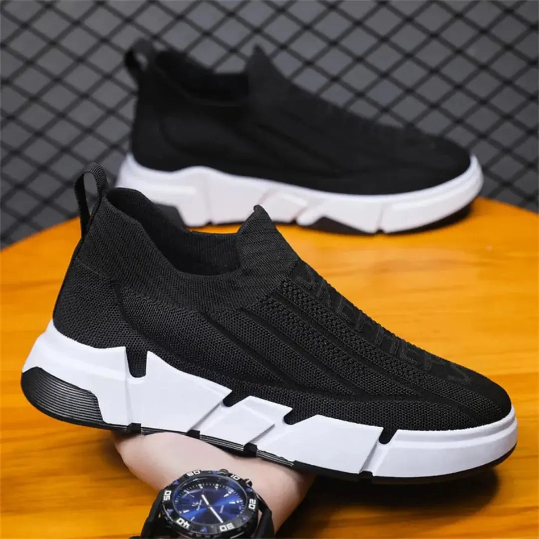 Urban gray adaptive knit sneakers with high-grip rubber sole, streamlined low-top silhouette for city movers