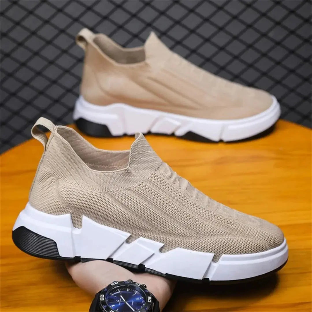 Black adaptive knit urban sneakers with high-grip rubber sole and breathable low-top performance design