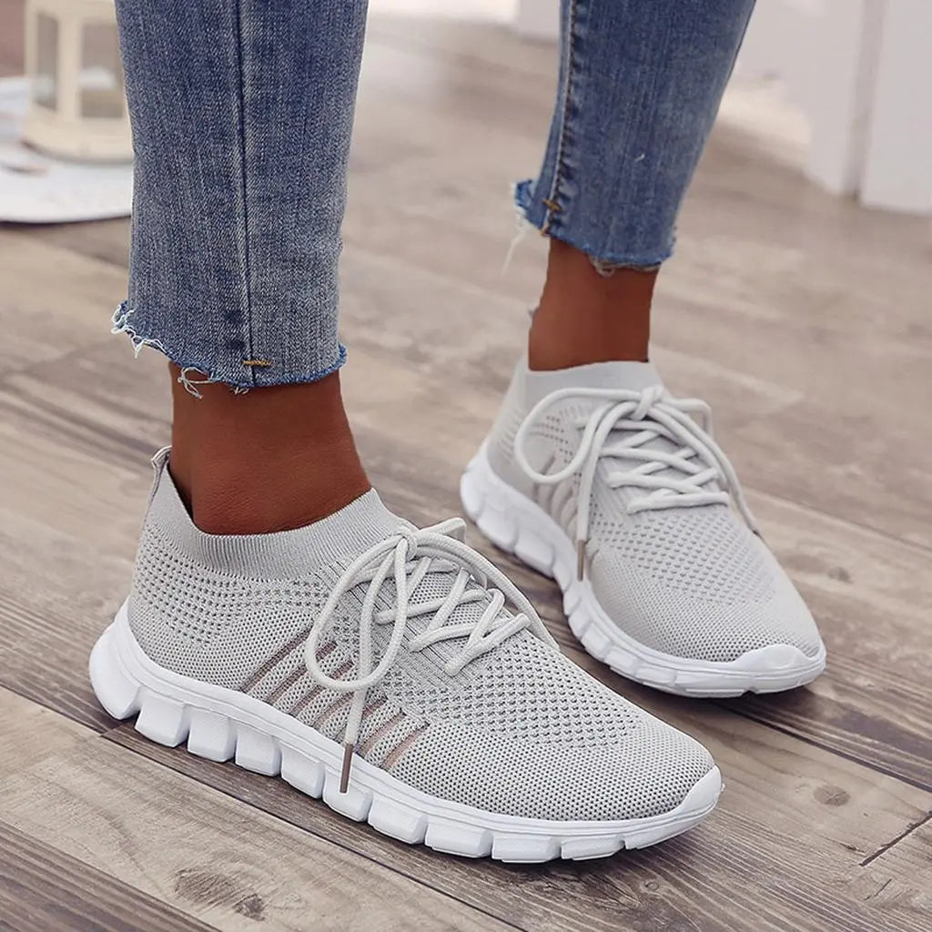 Women's white comfort sneakers with gel sole cushioning, adaptive fit for wide and narrow feet
