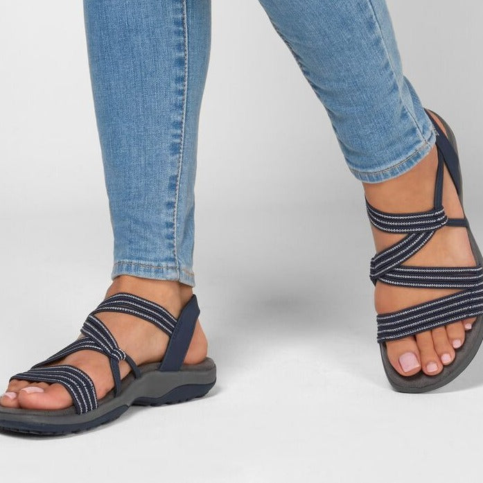 Black women's slip-on sport sandals with multi-strap design and cushioned arch support sole
