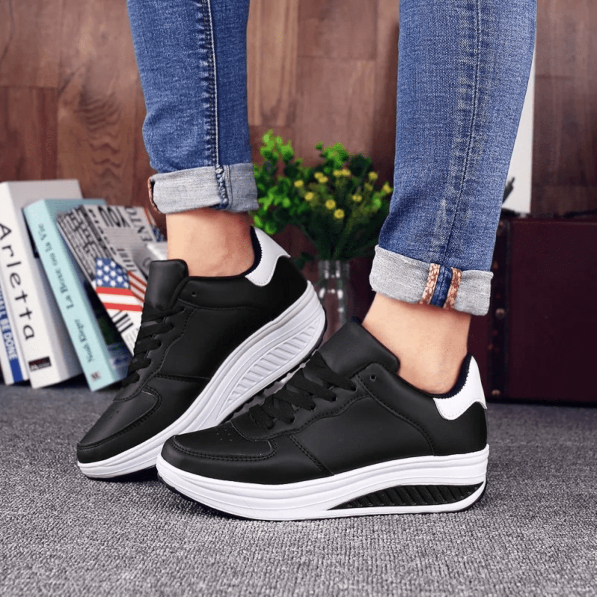 Women's black leather platform sneakers minimalist design with contrasting white cushioned sole