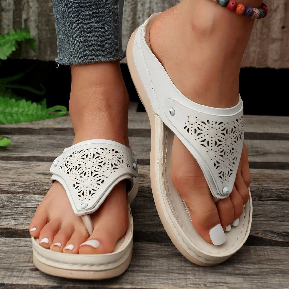Beige outdoor support sandals with contoured sole, multi-point straps, and open-toe breathable design