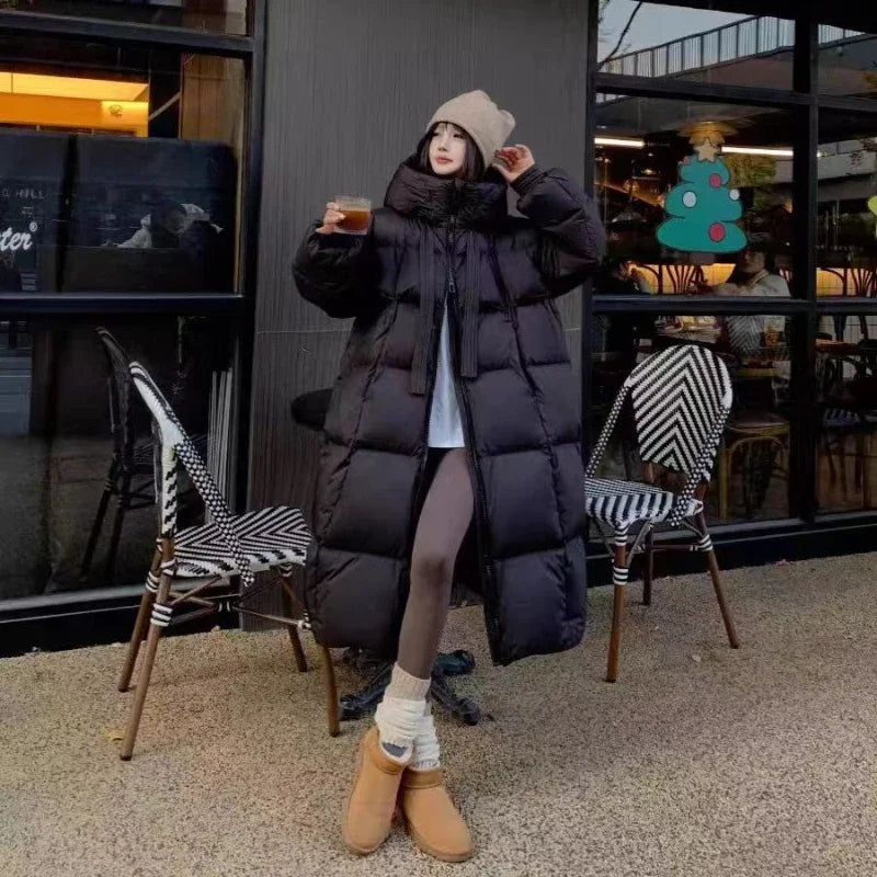 Women's oversized down jacket in neutral tone, casual silhouette with plush high-quality insulation for winter