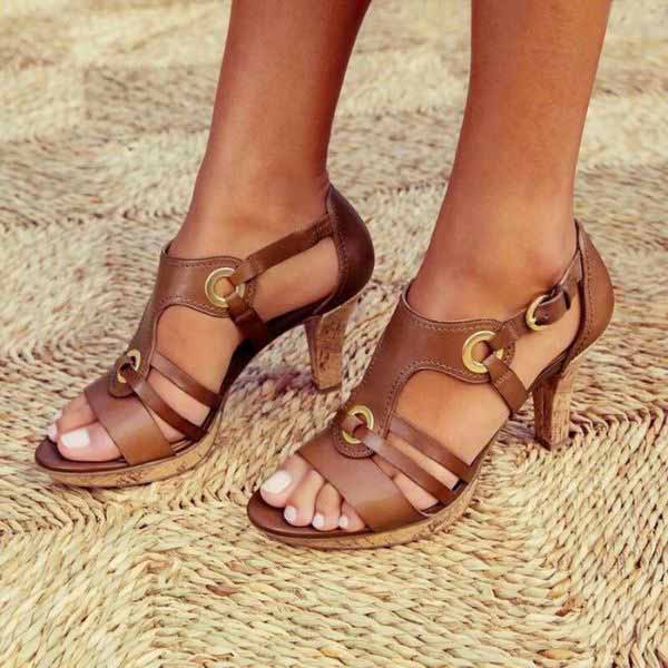 Women's elegant strappy high heel sandals in neutral tone with delicate slender straps for evening occasions
