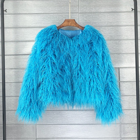 Women's bold winter coat oversized silhouette chic city style confident fashion statement