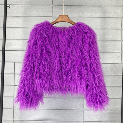 Women's bold winter coat voluminous silhouette chic city style confident trendy jacket