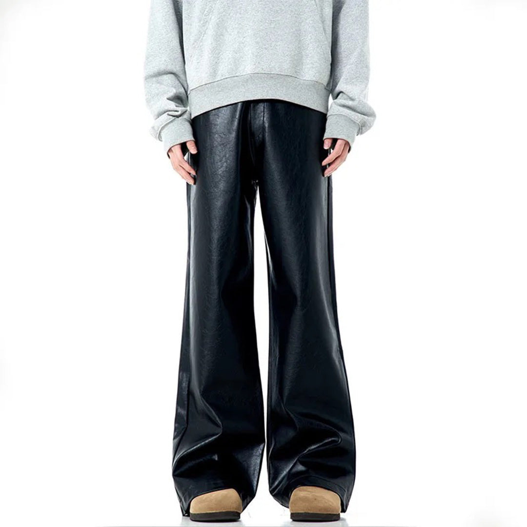 Black vegan leather bootcut midrise pants with American tailoring and sleek cruelty-free finish