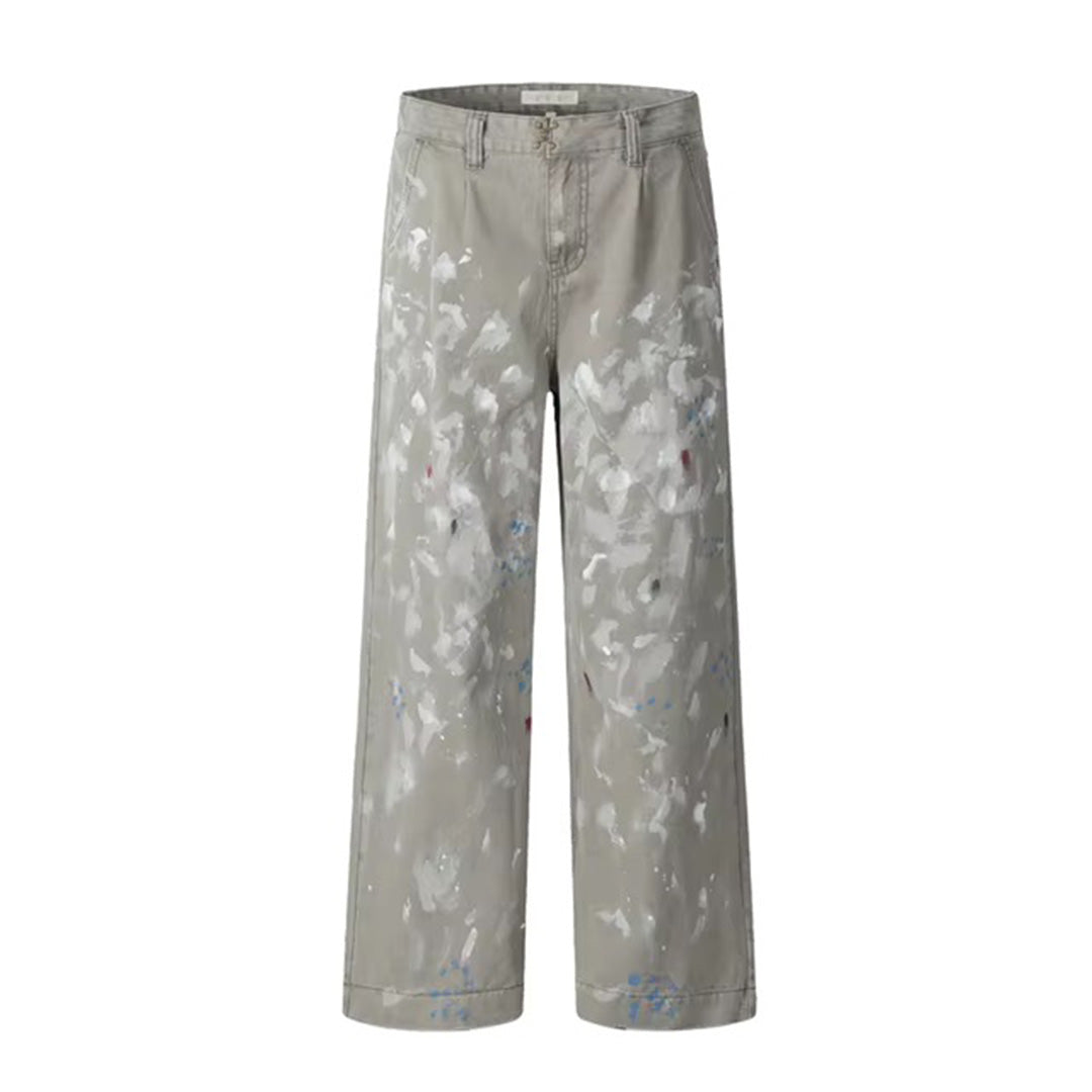 Black cotton loose straight-leg trousers with bold paint splatter and distressed artistic finish