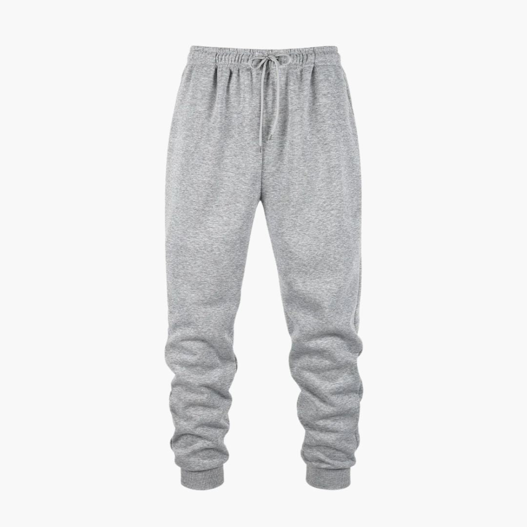 Men's loose fit jogger pants with ribbed ankles, elastic drawstring waist, and side pockets for active wear
