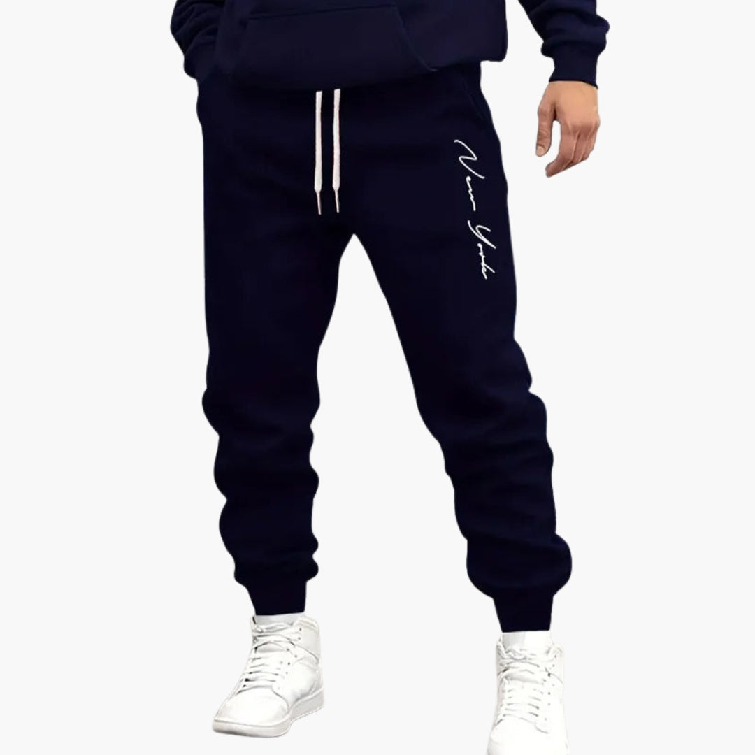 Men's gray jogger pants drawstring waist vertical printed leg pattern elastic ankles active comfort