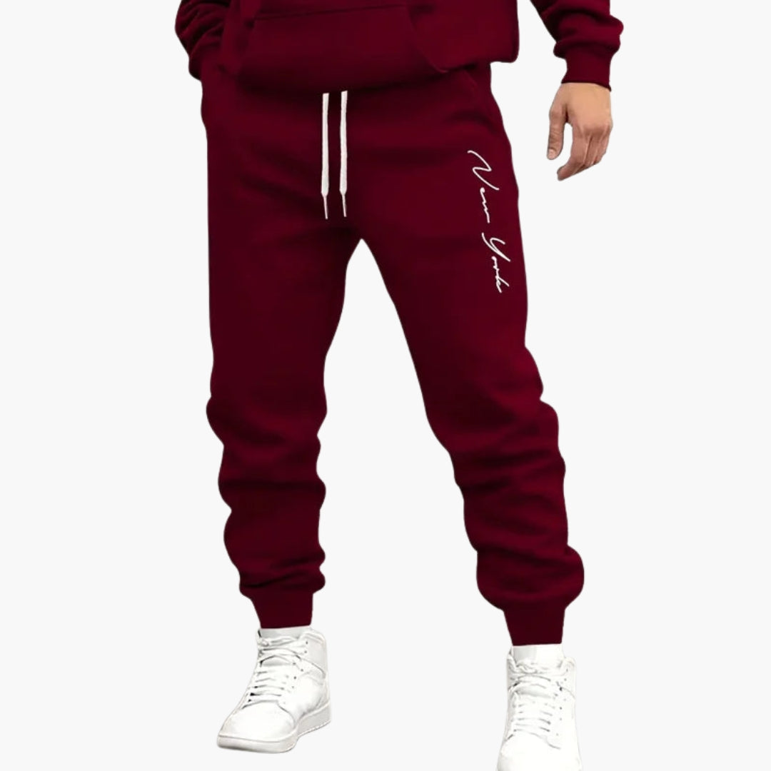 Men's gray jogger pants drawstring waist vertical leg pattern elastic ankles active comfort fit