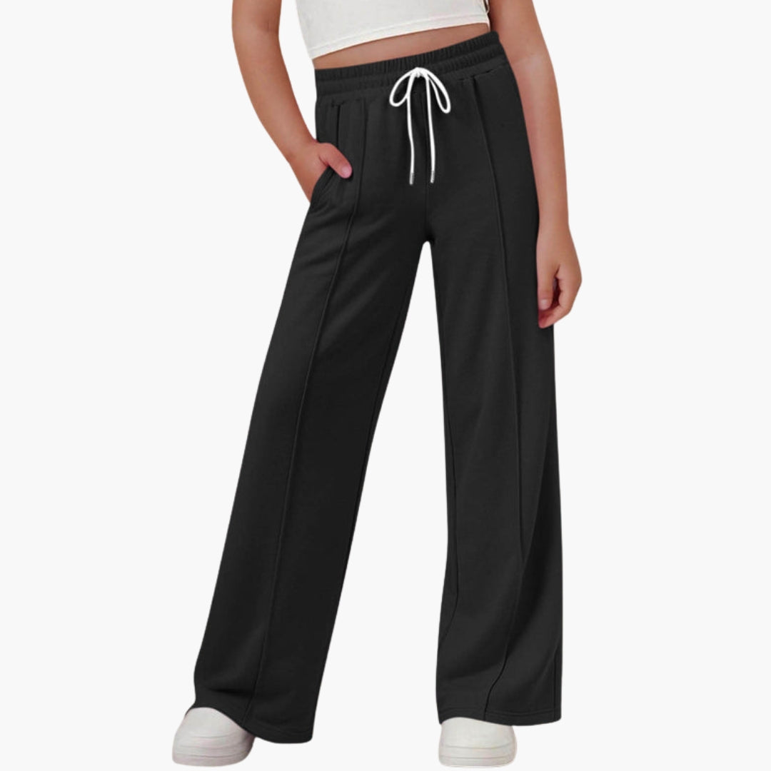 Women's wide-leg sports pants with adjustable drawstring waist, side pockets, relaxed active fit