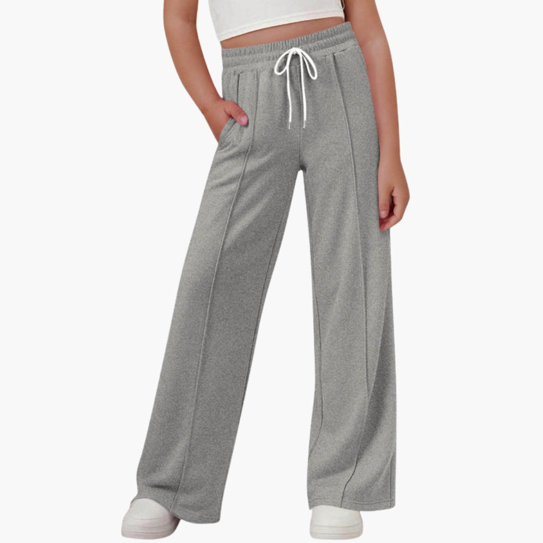 Women's wide-leg sports pants with adjustable drawstring waist, side pockets, relaxed active fit