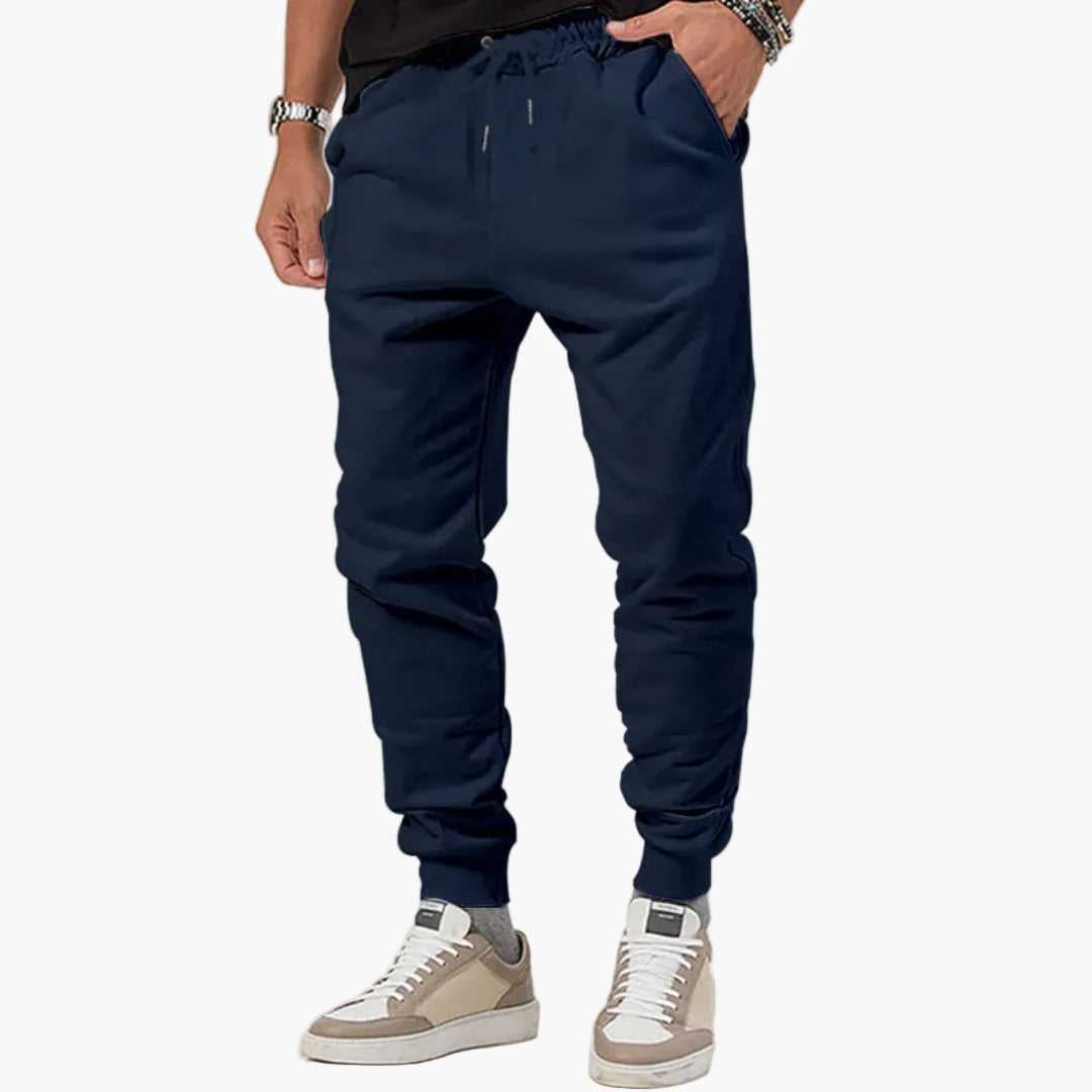 Men's tapered athletic joggers with elastic drawstring waistband, side pockets, and pull-on cuffs
