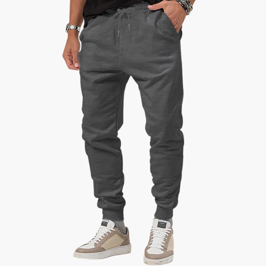 Men's tapered joggers with elastic drawstring waist, side pockets, slim cuffed ankles, athletic fit