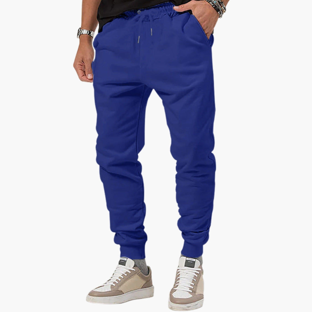 Men's tapered athletic joggers in neutral tone with elastic drawstring waist and side pockets