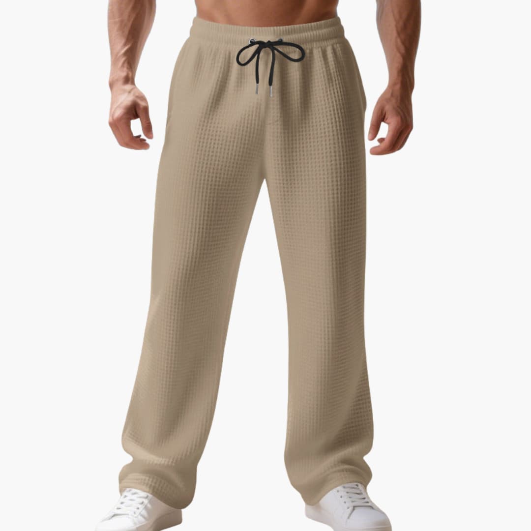 Men's gray athletic straight-leg pants with elastic waistband and adjustable drawstring closure