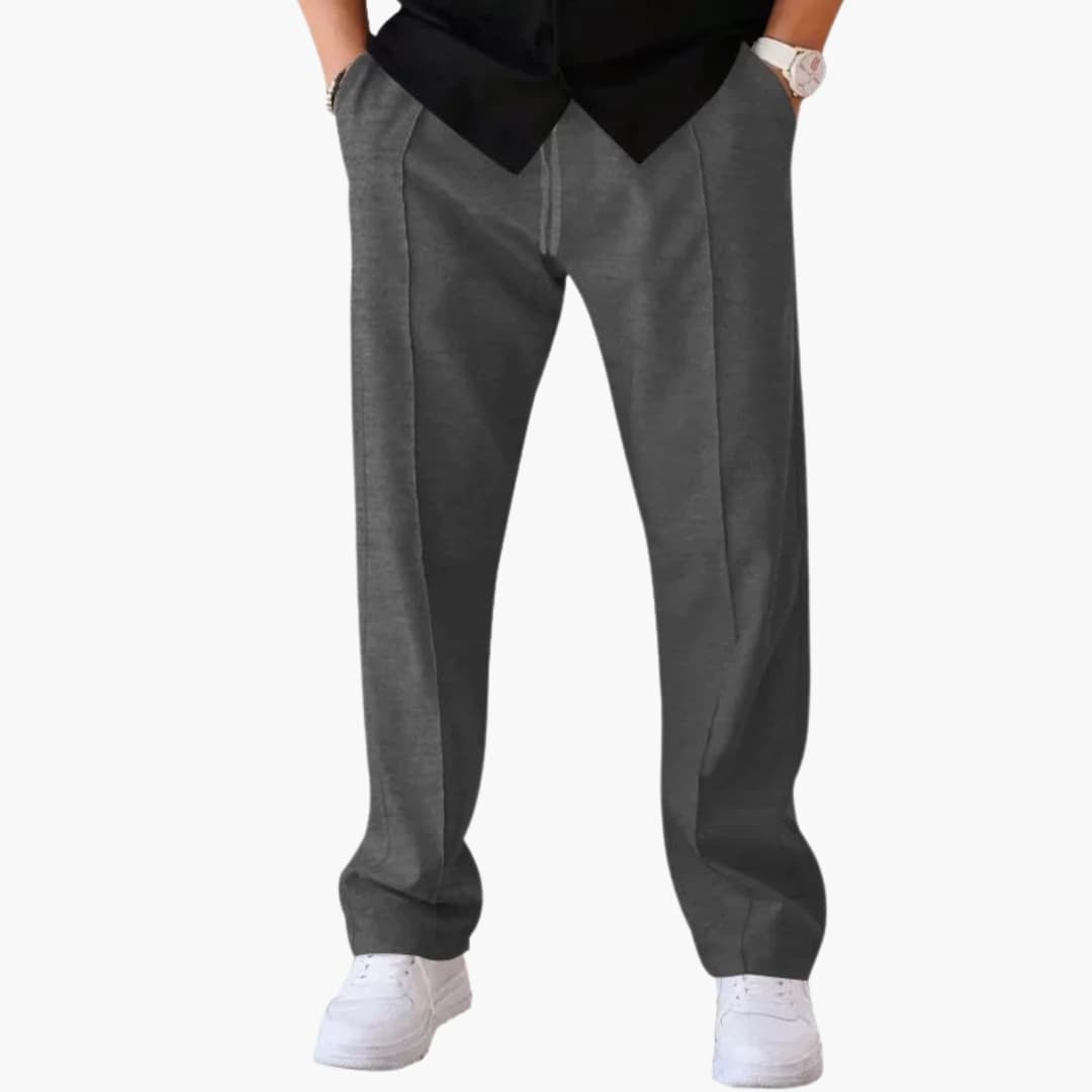 Men's loose straight-cut casual pants with adjustable drawstring waist in neutral mid-rise silhouette