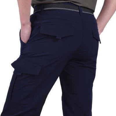 Men's slim fit cargo pants with multiple pockets in neutral tone, modern utilitarian style