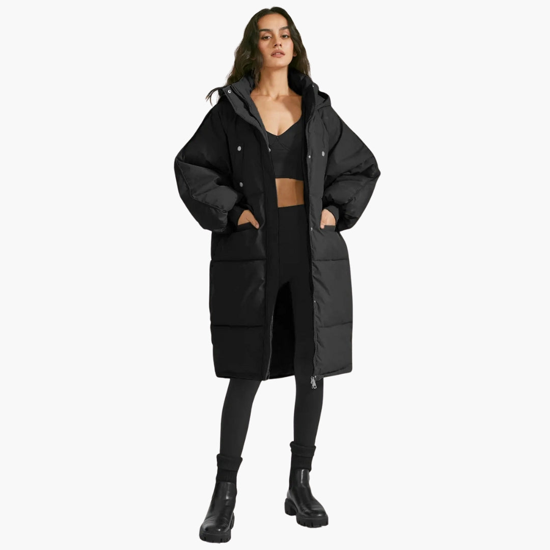 Women's quilted parka with hood, zipper closure, structured silhouette for cold weather warmth
