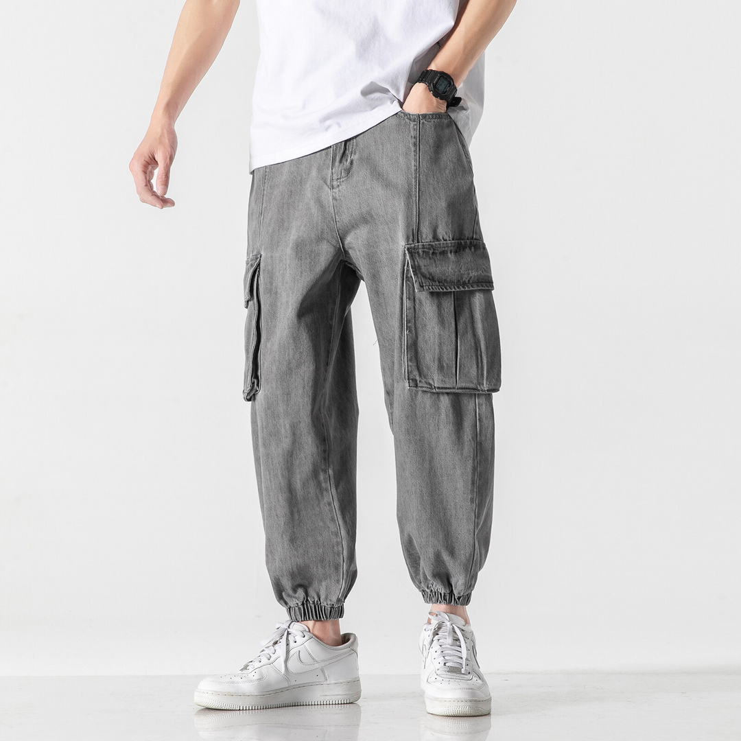 Men's washed grey denim cargo jogger pants with tapered fit and dual cargo pockets