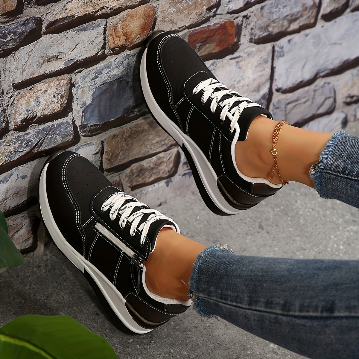 Women's white perforated low-top sneakers with breathable design, lace-up closure, and cushioned sole