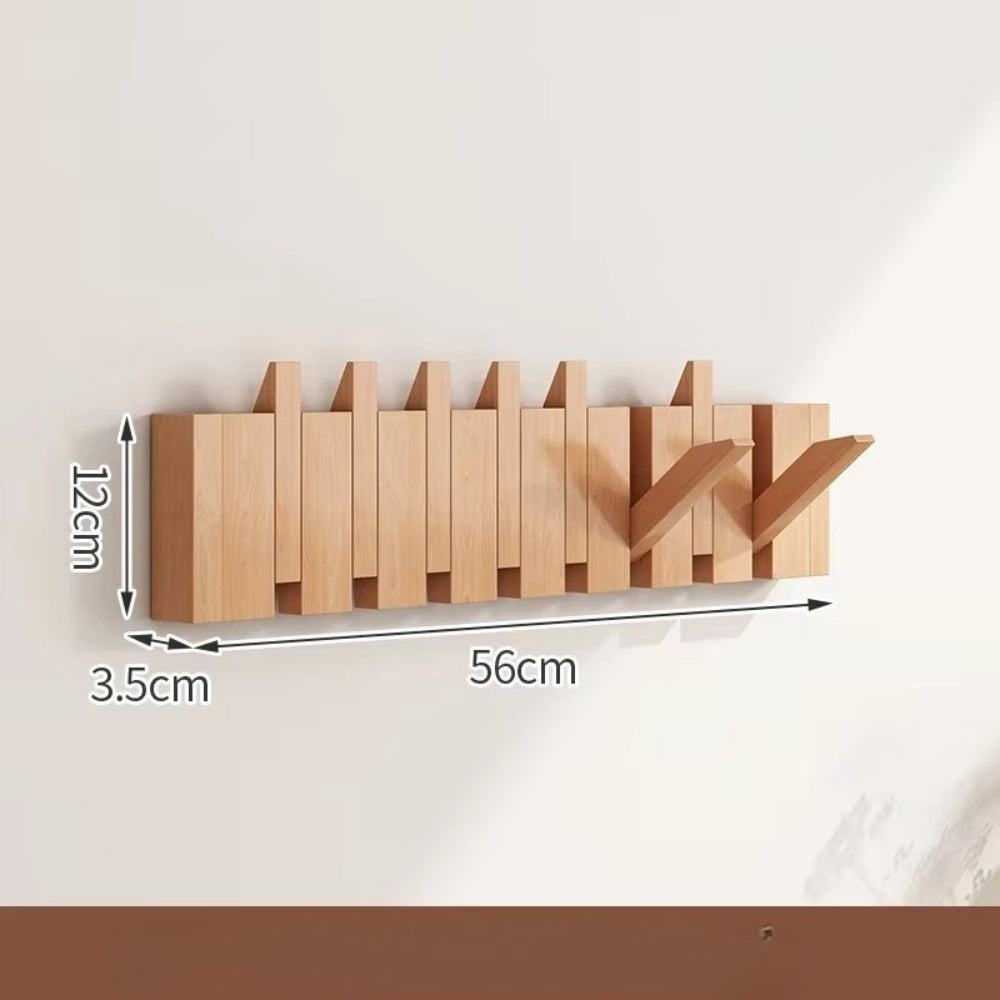 Minimalist wooden wall hook rack with foldable flip hooks for entryway space-saving organization