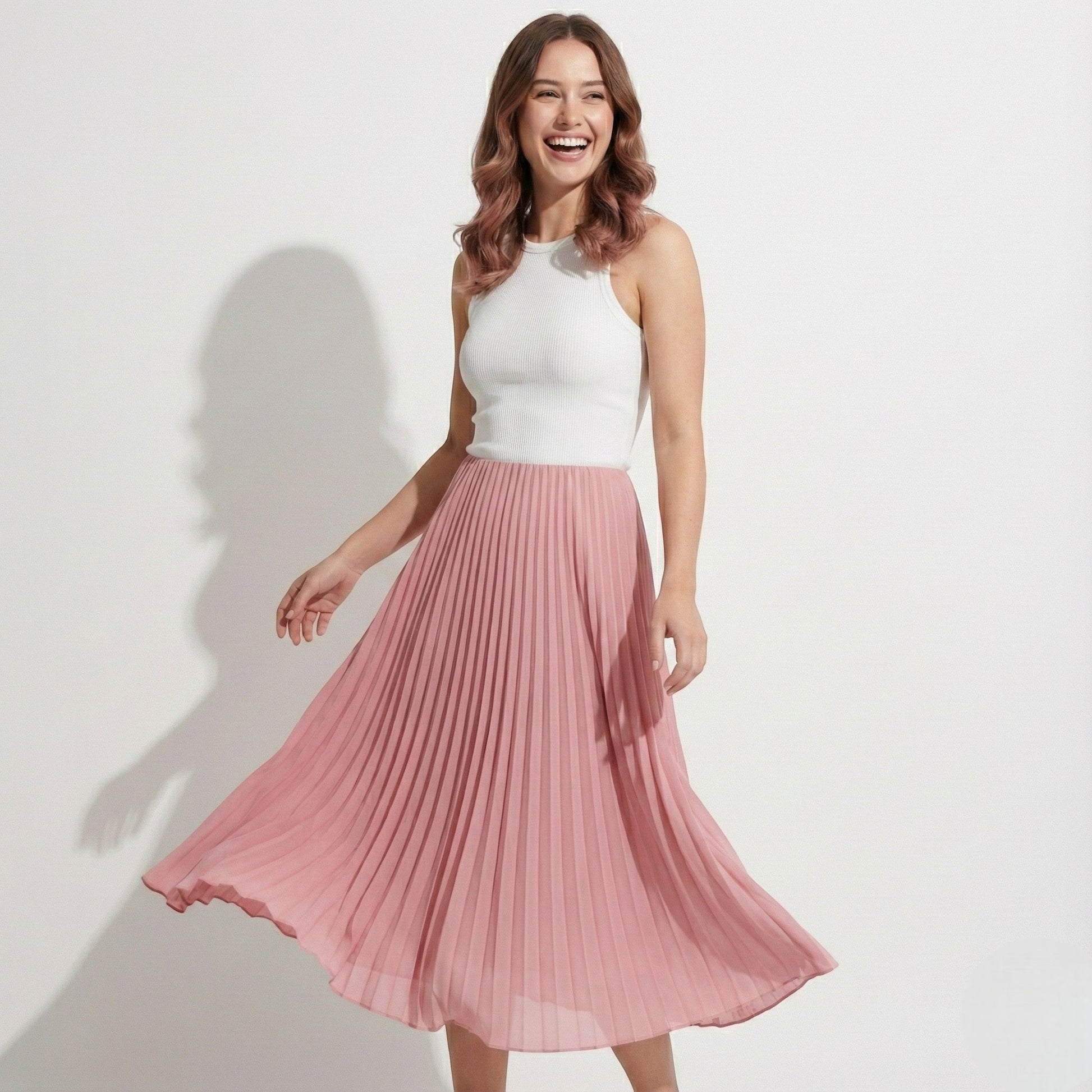 Women's high-waisted pleated satin skirt in neutral tone, flattering regular fit with elegant drape