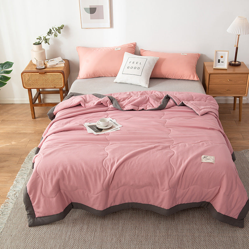 Minimalist white cotton quilt with stitched pattern, lightweight breathable design for hot sleepers