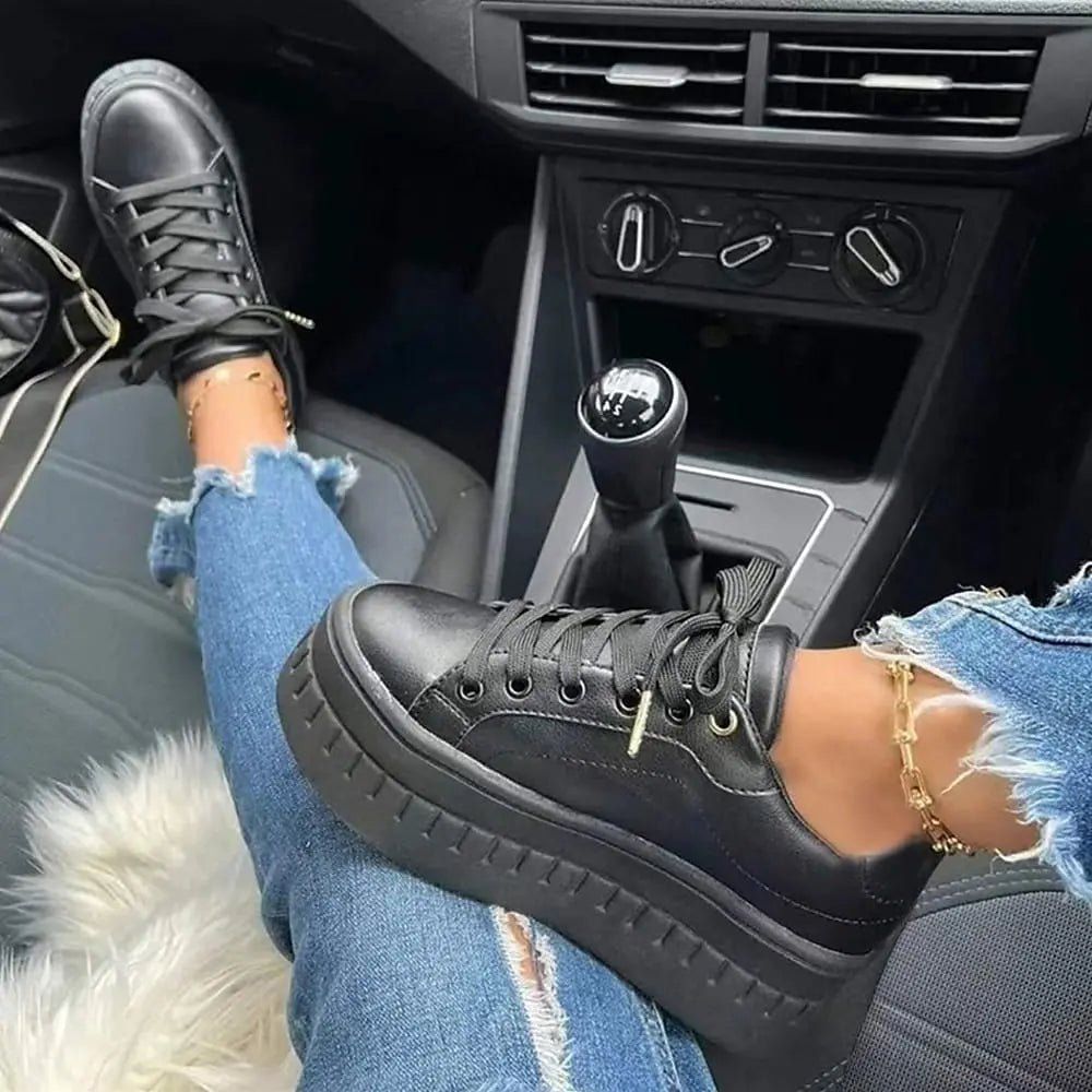 Women's white platform sneakers with chunky sole, lightweight silhouette, and all-day comfort design