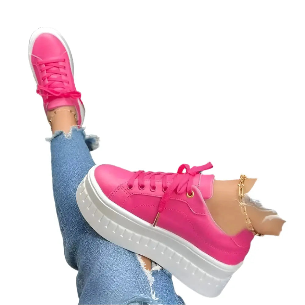 Women's white platform sneakers with chunky sole, lightweight silhouette, and all-day comfort design