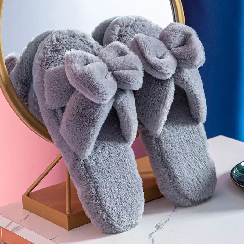 Women's pink plush faux fur slippers with bow detail, ultra-soft lining and non-slip TPR sole