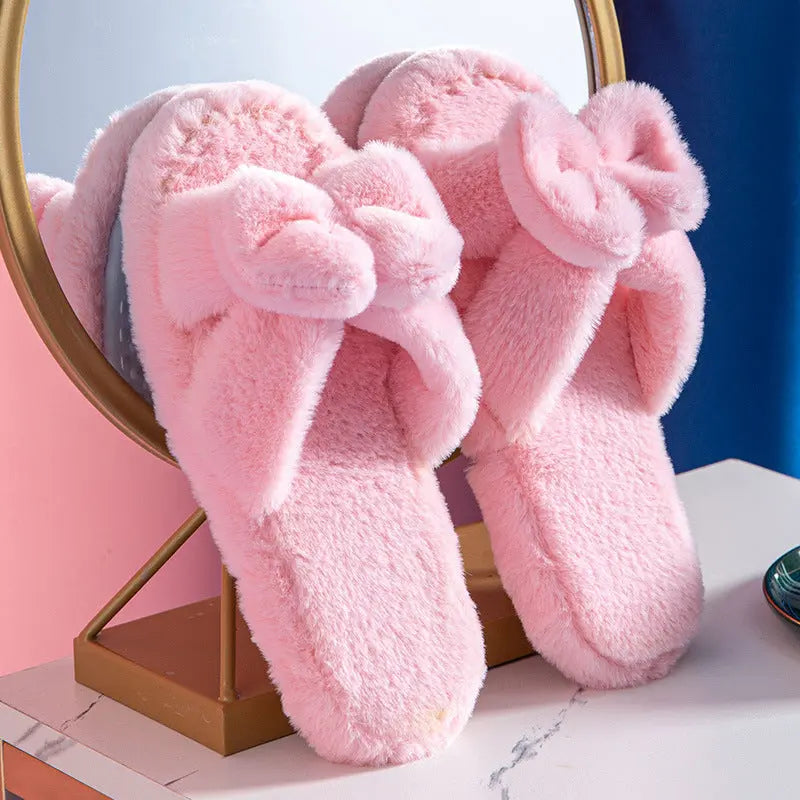 Women's pink plush faux fur slippers with bow accent, ultra-soft lining, non-slip TPR sole