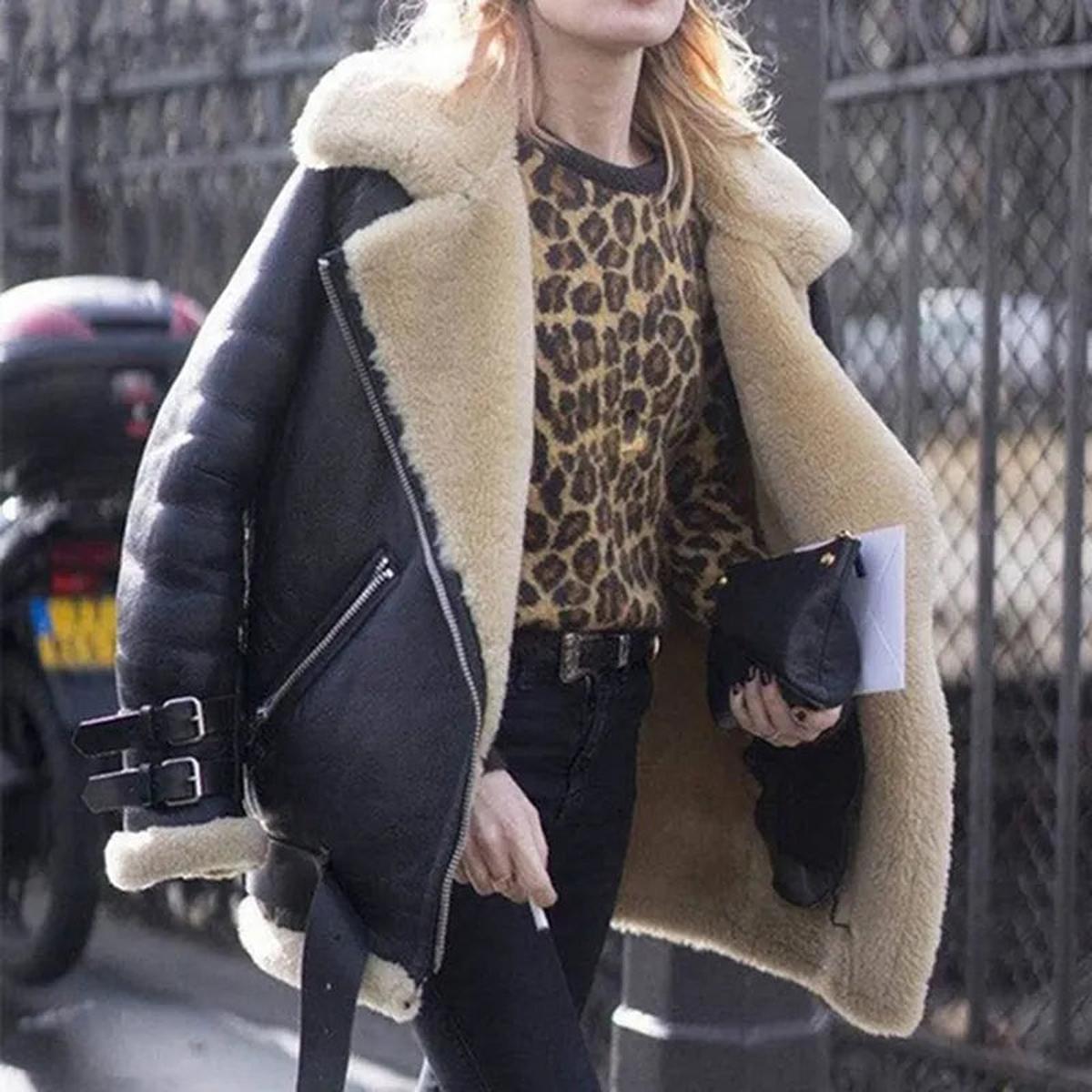 Women's black faux fur lined moto jacket with oversized plush collar and edgy zip-front silhouette