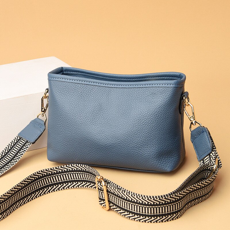 Black synthetic leather women's sling bag vintage style with adjustable crossbody strap and spacious interior