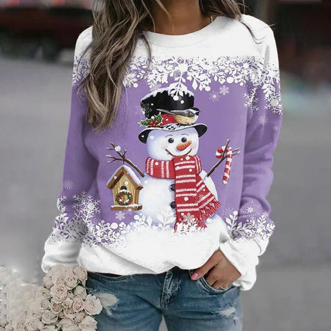 Women's cozy relaxed-fit winter sweater with vibrant snowman graphic and festive snowflake accents