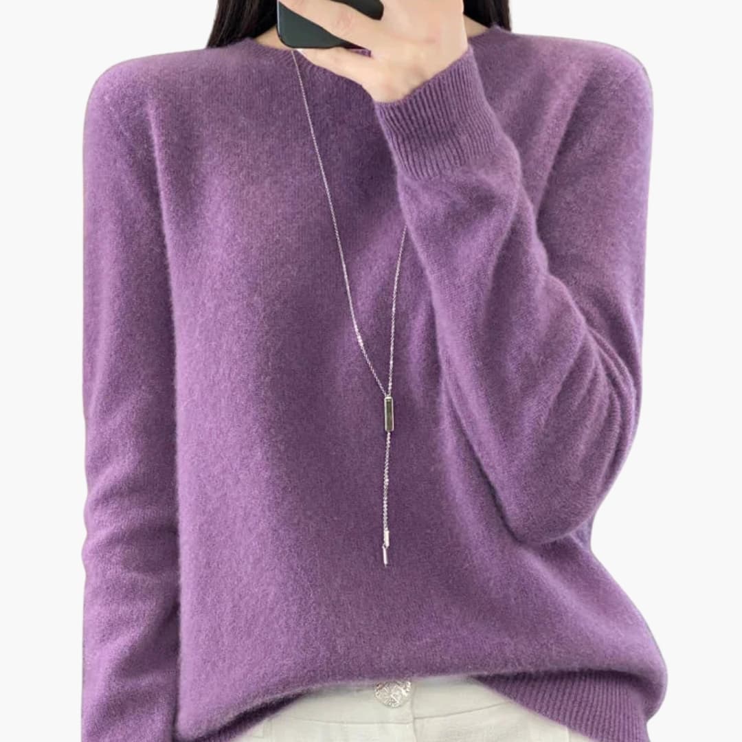 Women's minimalist round neck pullover sweater with ribbed cuffs, hem, and timeless knit design