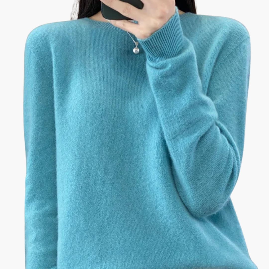 Women's minimalist round neck pullover sweater with ribbed cuffs, hem, and timeless knit design